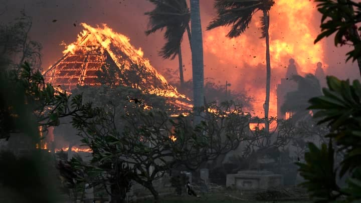 A historic building burning in Lahaina during the August 2023 wildfire